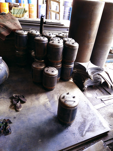 Small unpainted tank bodies and rolled steel shells in the Aircon workshop